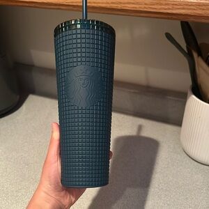 Greenish blue Starbucks cup.